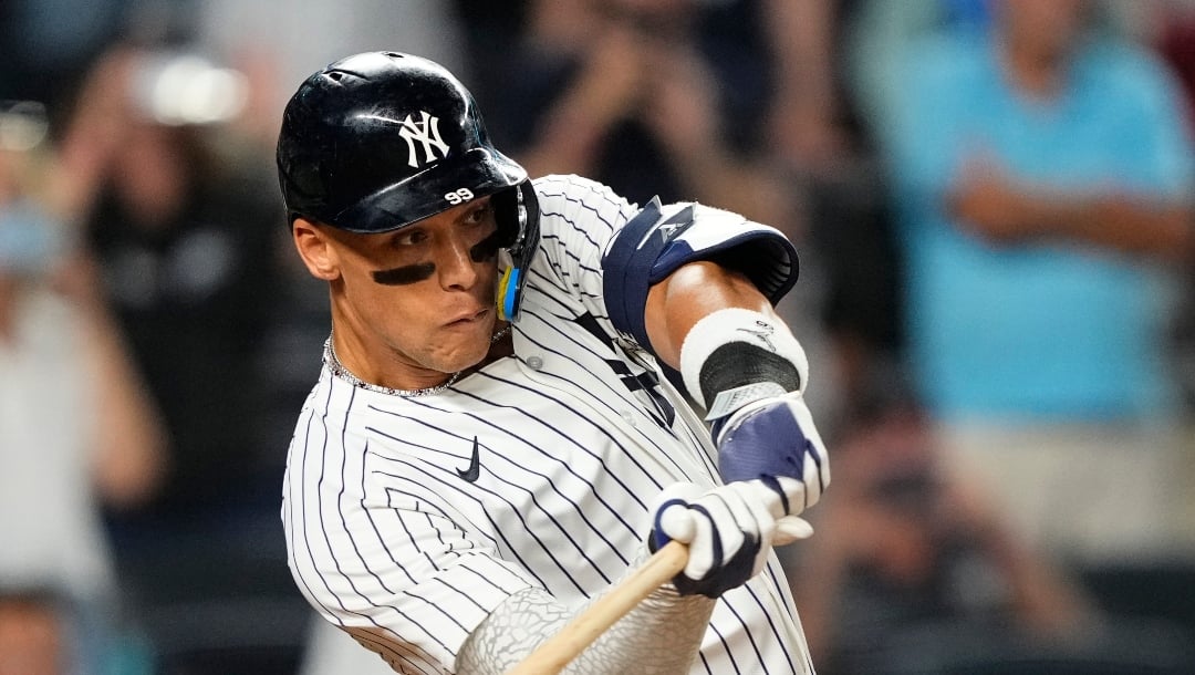 New York Yankees designated hitter Aaron Judge hits a sacrifice fly during the 10th inning of a baseball game against the Seattle Mariners, Thursday, July 10, 2025, in New York. (AP Photo/Yuki Iwamura)