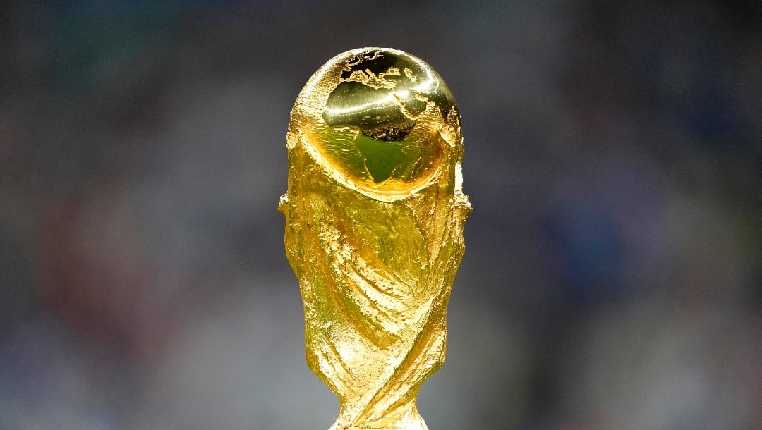FILE - The trophy is displayed on the pitch ahead of the World Cup final soccer match between Argentina and France at the Lusail Stadium in Lusail, Qatar, Dec. 18, 2022. (AP Photo/Martin Meissner, File)