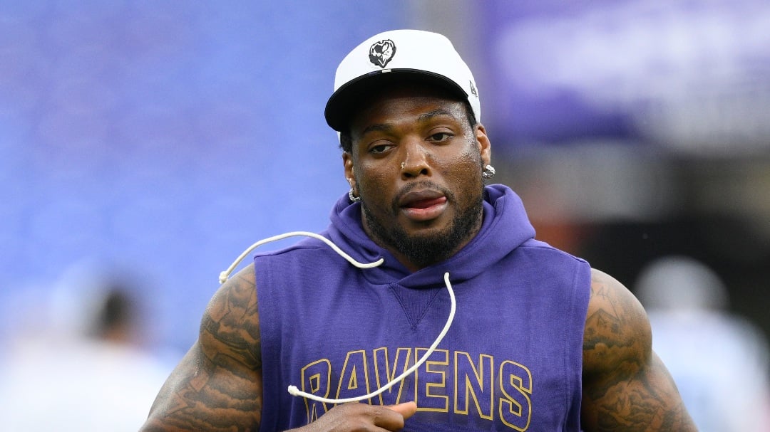 Baltimore Ravens running back Derrick Henry (22) works out before a preseason NFL football game against the Indianapolis Colts, Thursday, Aug. 7, 2025, in Baltimore. (AP Foto/Nick Wass)