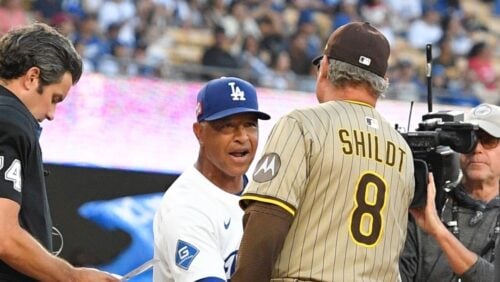 Los Angeles Dodgers manager Dave Roberts, second from left, greets San Diego Padres manager Mike Shildt prior to a baseball game Friday, Aug. 15, 2025, in Los Angeles. (AP Photo/Mark J. Terrill)