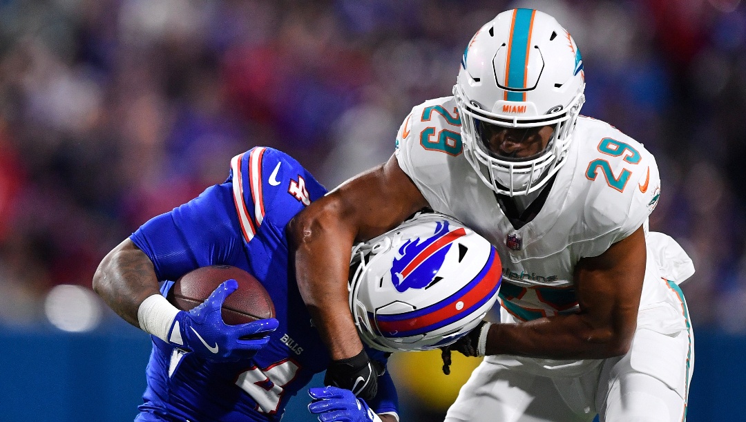 Miami Dolphins free safety Minkah Fitzpatrick (29) tackles Buffalo Bills running back James Cook (4) during the first half of an NFL football game, Thursday, Sept. 18, 2025, in Orchard Park, N.Y. (AP Photo/Adrian Kraus)