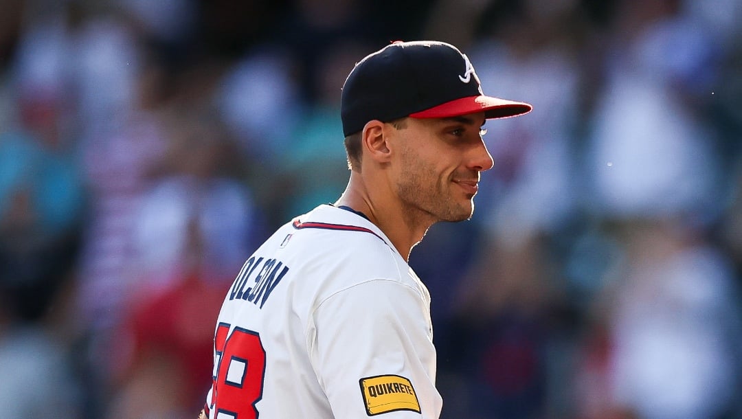 Atlanta Braves' Matt Olson, left, high-fives pitcher Raisel Iglesias, right, after a baseball game against the Pittsburgh Pirates, Sunday, Sept. 28, 2025, in Atlanta. (AP Photo/Colin Hubbard)