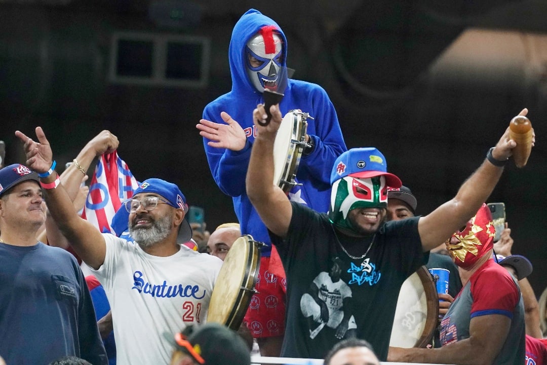 Puerto Rico fans cheer the team during the fourth inning of a World Baseball Classic game against Mexico, Friday, March 17, 2023, in Miami. (AP Photo/Marta Lavandier)