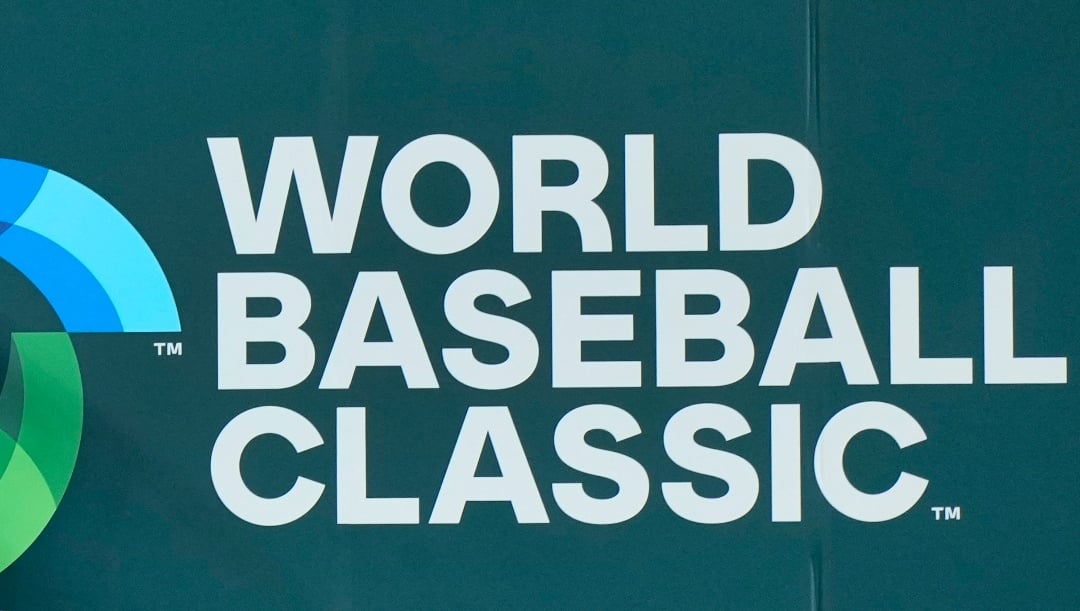 Israel center fielder Joc Pederson bounces off the wall after attempting to catch a ball hit by Puerto Rico's Francisco Lindor during the fifth inning of a World Baseball Classic game, Monday, March 13, 2023, in Miami. Lindor tripled scoring Javier Baez, Vimael Machin and Martin Maldonado. (AP Photo/Wilfredo Lee)