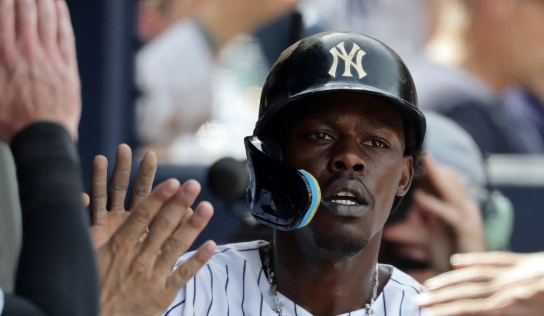 New York Yankees' Jazz Chisholm Jr. celebrates with teammates after scoring a run during the seventh inning of a baseball game against the Cleveland Guardians, Thursday, June 4, 2026, in New York. (AP Photo/Adam Hunger)