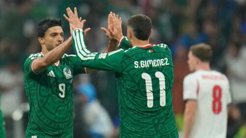 Mexico's Raul Jimenez (9) celebrates with Santiago Gimenez (11) after scoring the team's second goal off a penalty kick during the World Cup round of 16 soccer match between Mexico and England in Mexico City, Sunday, July 5, 2026. (AP Photo/Ricardo Mazalan)